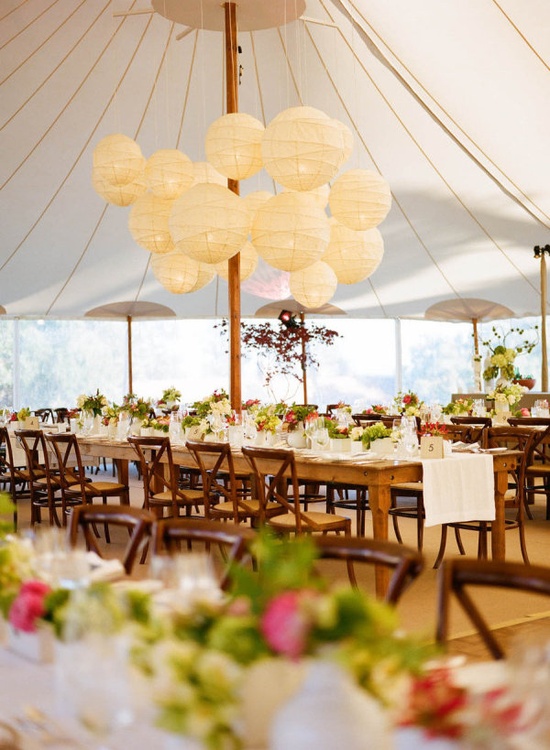 Bunch of ivory lanterns in center of tent