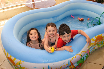 My three elder kids three kids in a boat